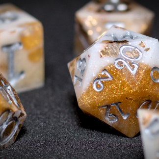 Dice set, white and gold with gold flecks.