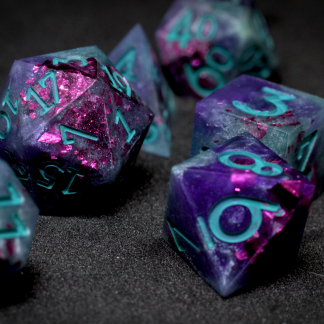handcrafted dice with violet, teal, and iridescent pink
