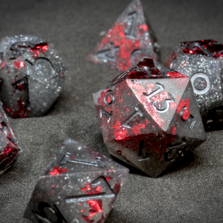 These handcrafted dice are a striking combination of dark, smoky tones and vivid crimson flecks